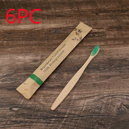 10 natural bamboo toothbrushes with charcoal bristles in six colours showing 17.5cm length