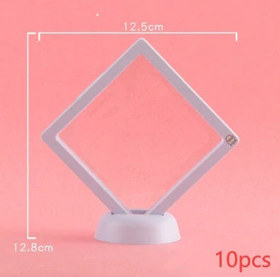 3D floating jewelry coin display stand in white and black, showcasing collectibles in mid-air