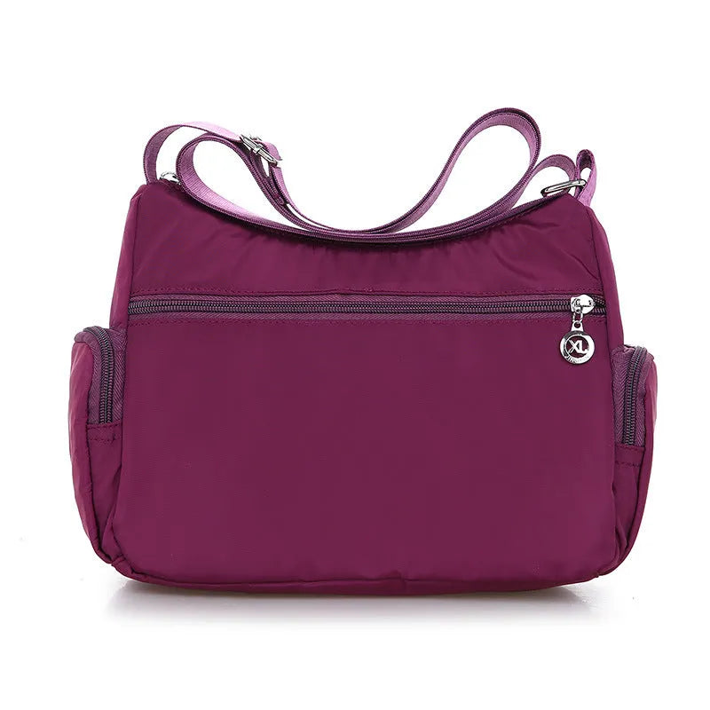 Women's nylon shoulder bag with multi-pocket design, zip opening and detachable handle in red, purple, black or army green