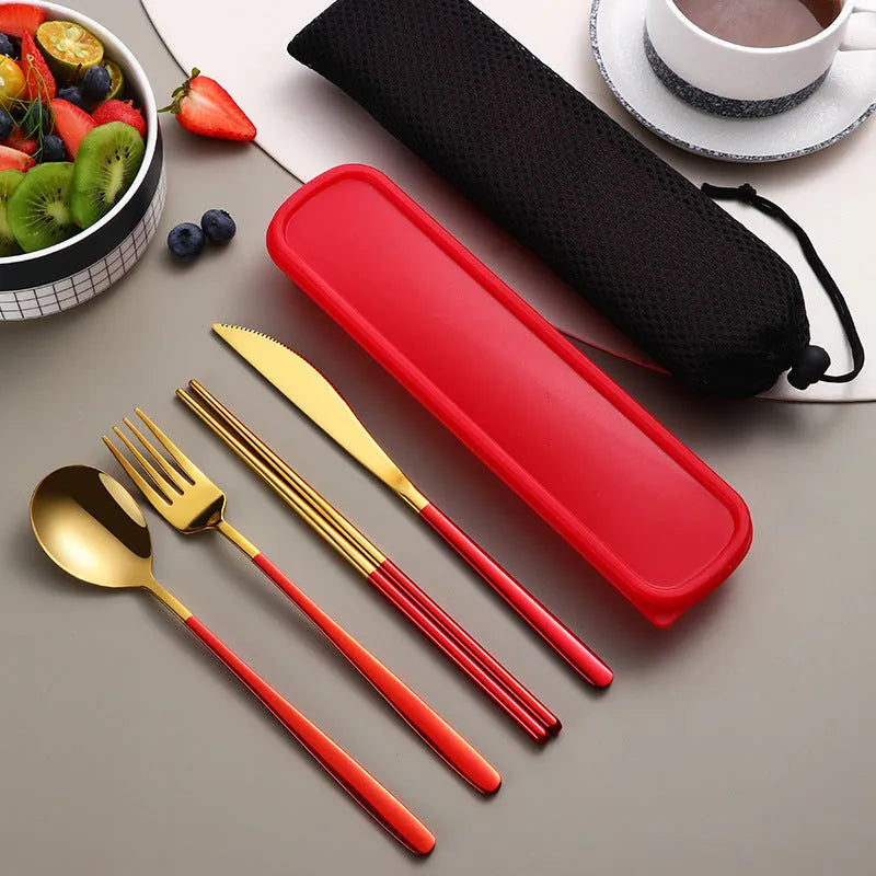 Gold and black stainless steel knife fork spoon set inside a grey mesh carrying bag.