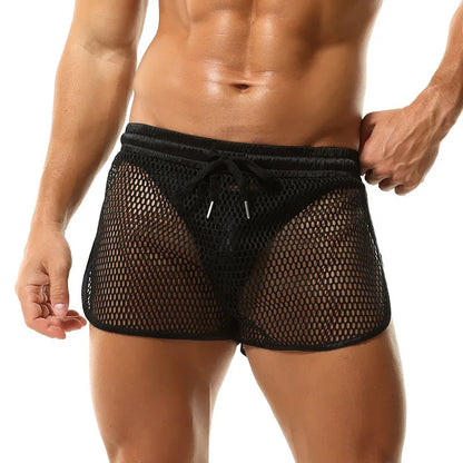 Men's solid colour loose fit polyester boxer shorts shown in black, white, grey, and red.