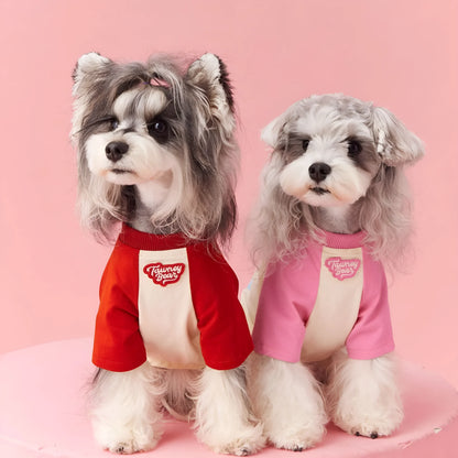 Red cotton dog summer clothes with contrast embroidery, laid flat showing size label.