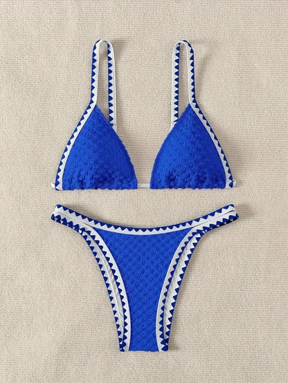 Women's blue or white two-piece bikini swimsuit with briefs style.