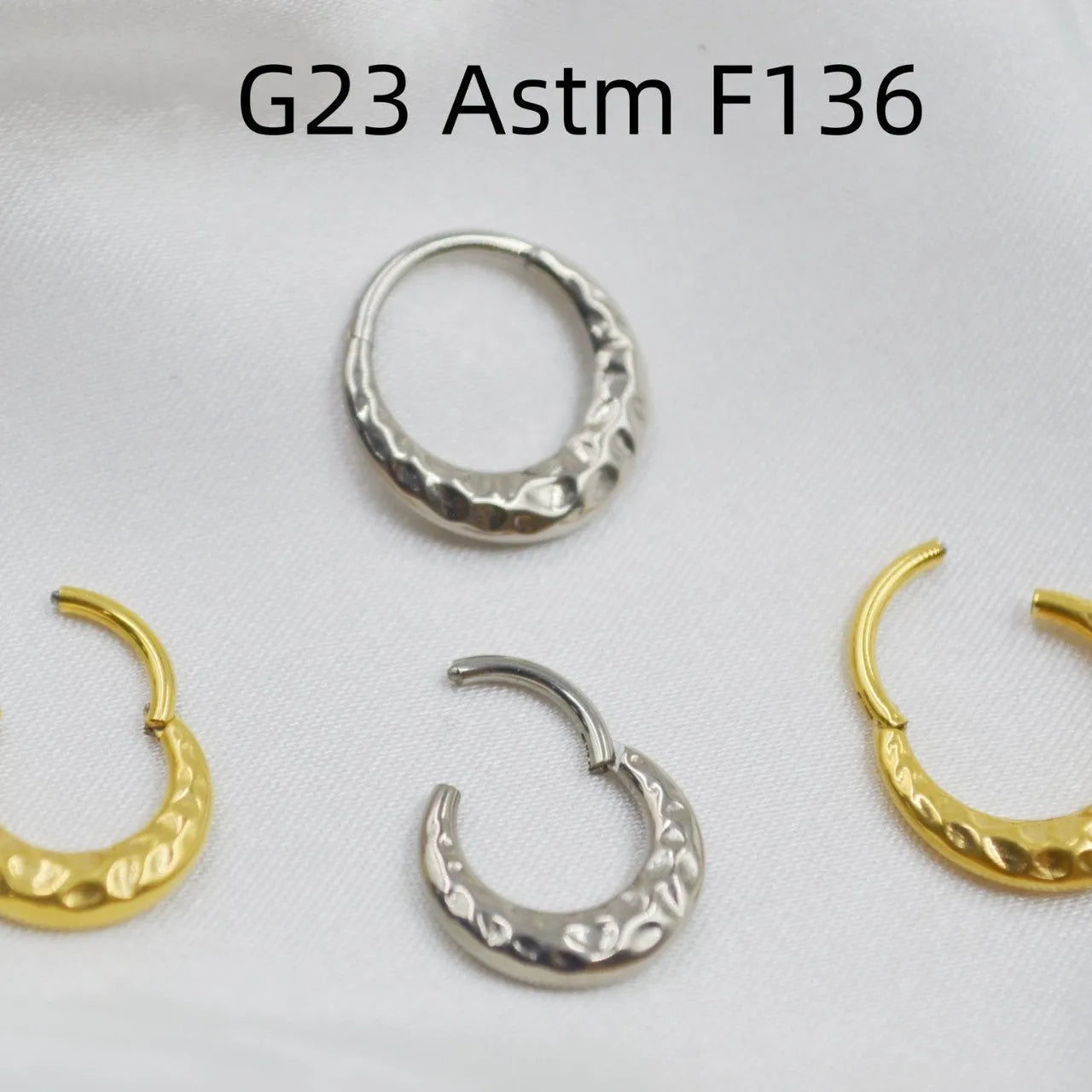 Titanium alloy concave-convex nose ring in gold or silver colour with carved design texture
