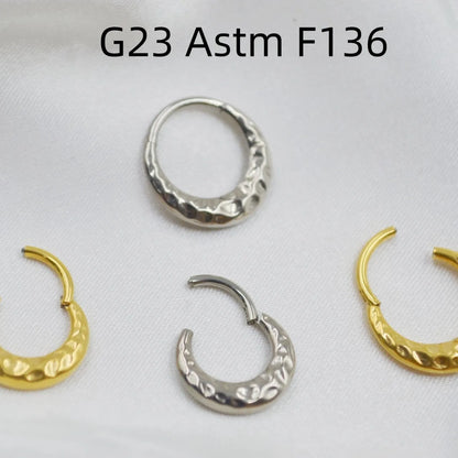 Titanium alloy concave-convex nose ring in gold or silver colour with carved design texture