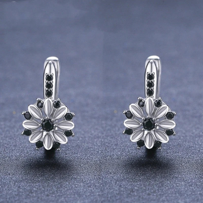 Copper flower ear clips with zircon inlays for women, black colour variant