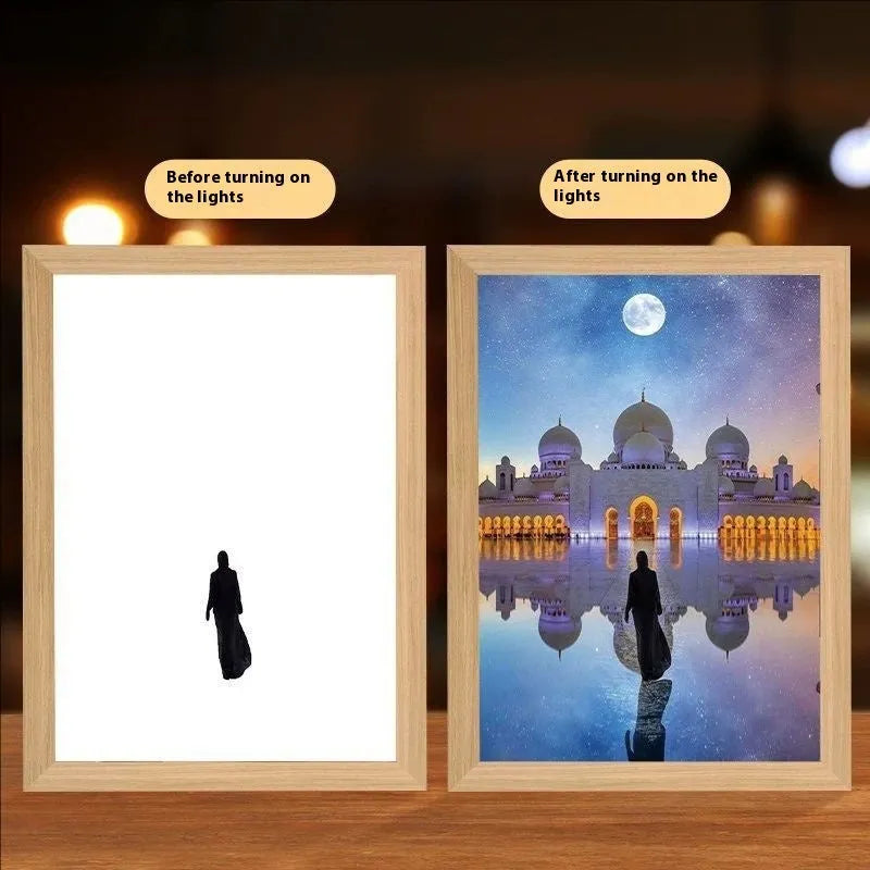 Modern rectangular light painting photo frame displaying an illuminated cross and scenic artwork.