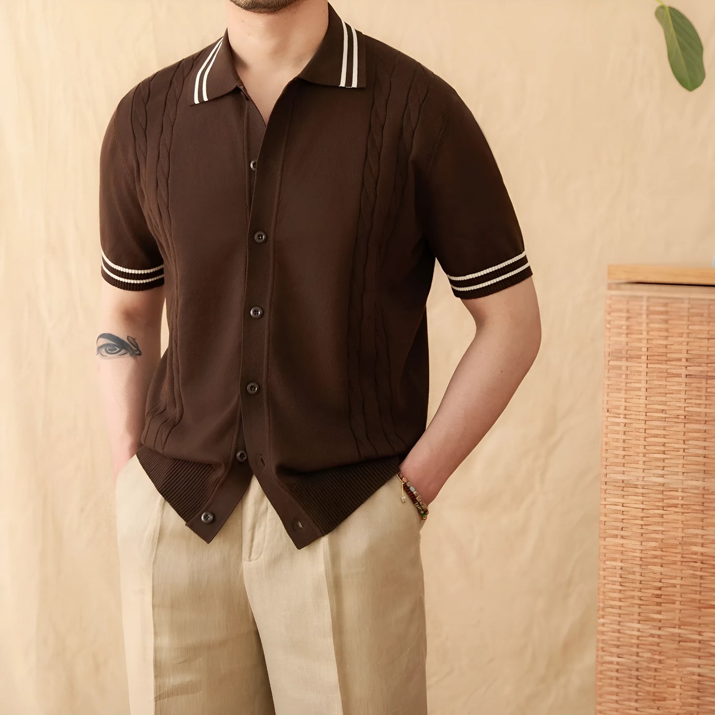 Men's apricot-coloured short-sleeved polo shirt with a lapel collar, laid flat.