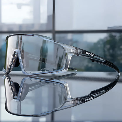 Photochromic cycling sunglasses with TR90 frame in semi-rimless unisex style on a solid colour background.