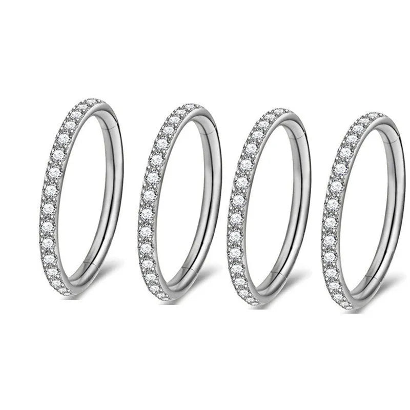 A seamless round hoop nose ring in stainless steel, shown alongside gold and rose gold colour options.