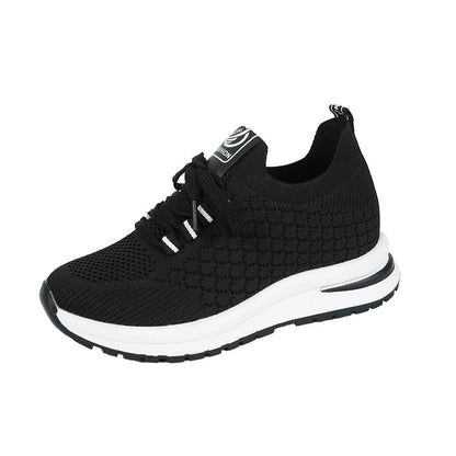 Women's flat lace-up mesh sneakers in black and white colours with round toe