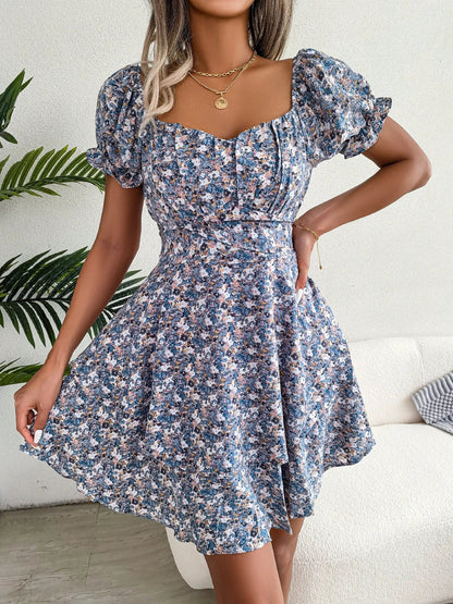 Stylish floral mini dress with ruffled skirt, high-waist design, and short sleeves for a flattering and comfortable summer look