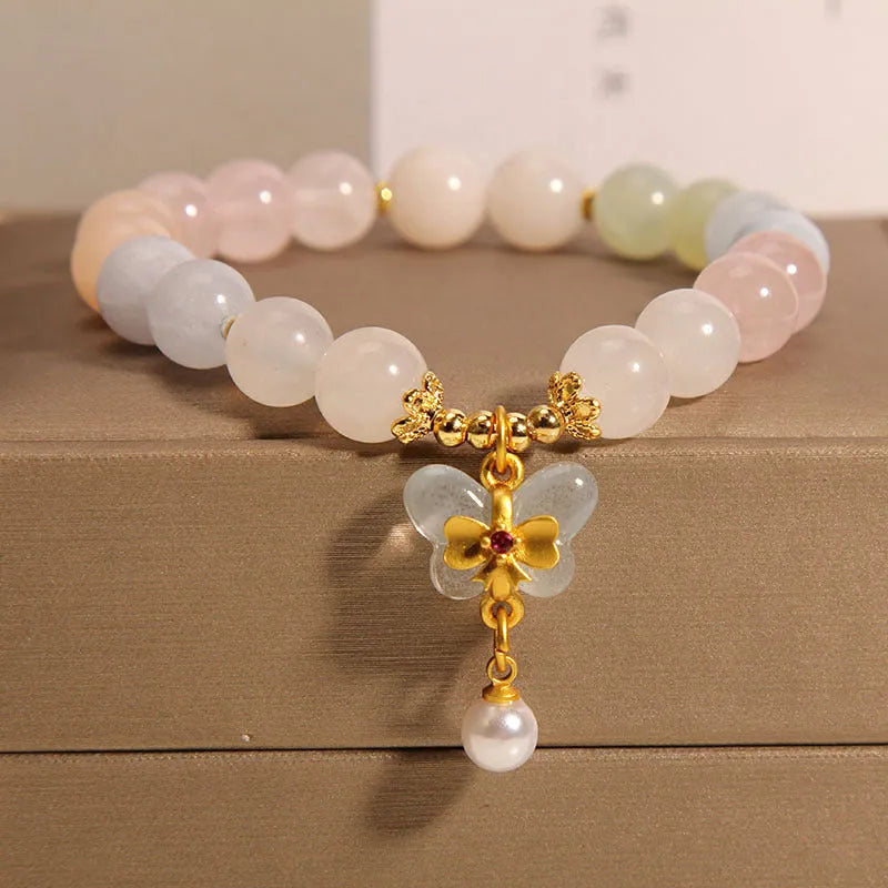 Original design women's bracelet with colourful morganite butterfly pendant made from crystal and jade.