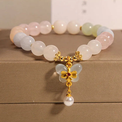 Original design women's bracelet with colourful morganite butterfly pendant made from crystal and jade.