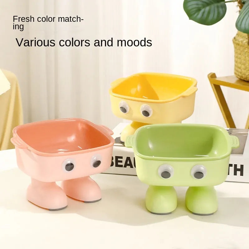 Robot-shaped elevated cat bowl with 15 degree tilt in green colour with detachable inner bowl