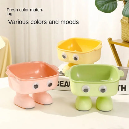 Robot-shaped elevated cat bowl with 15 degree tilt in green colour with detachable inner bowl
