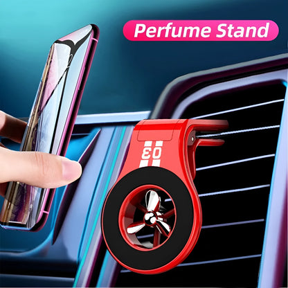 Black magnetic car phone holder attached to air vent with phone mounted and fragrance slice visible