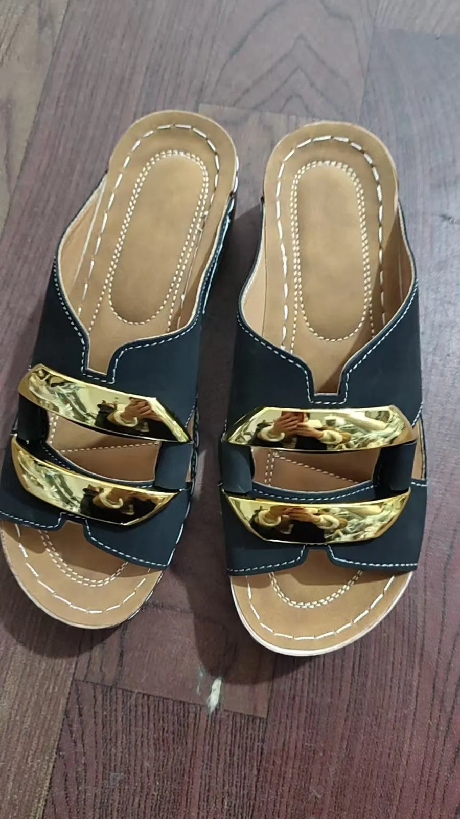 Roman-style platform flip-flop sandals in black, white, khaki, and sea blue on a rubber sole.