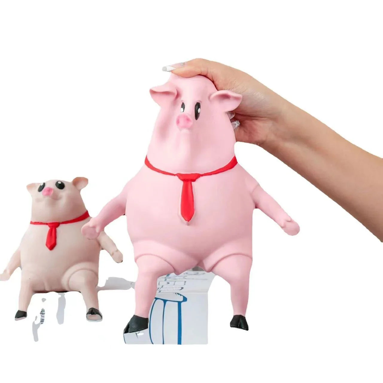 Adorable piggy-shaped stress relief toy made of eco-friendly rubber with a charming red scarf design
