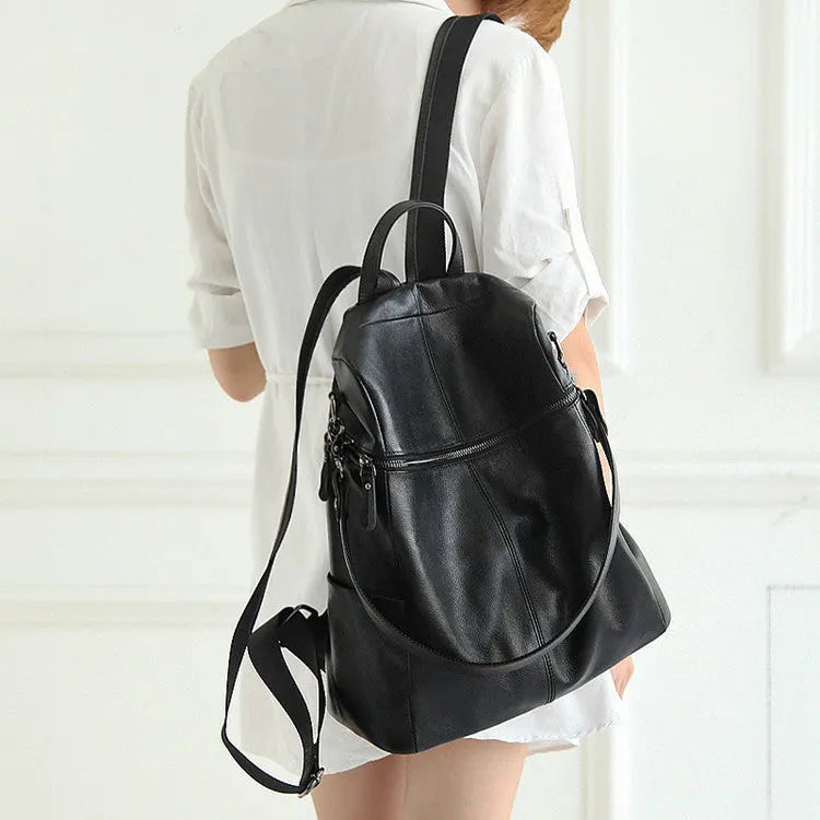 Genuine leather women's retro backpack in large capacity with waterproof construction and internal compartments