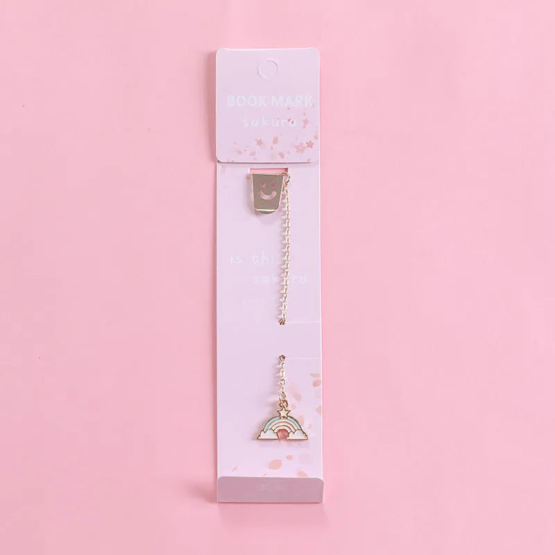 Alloy metal cartoon pendant bookmark with colourful charms including panda, rocket, and wishing bottle designs