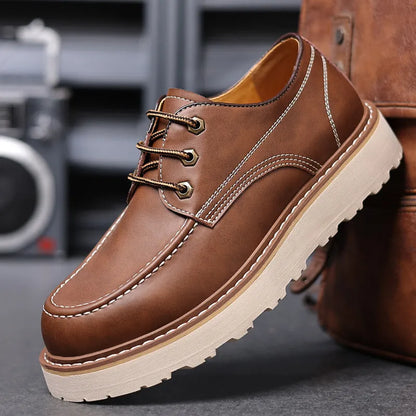 Men's black low-top Martin boot with round toe and non-slip rubber sole on a white background.