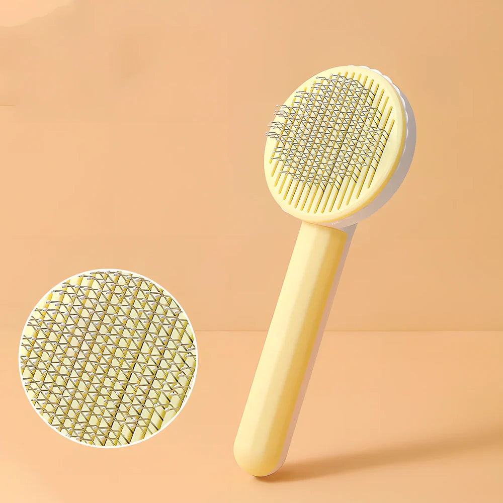 Self-cleaning cat comb with floating needle teeth and built-in hair storage chamber in assorted colours