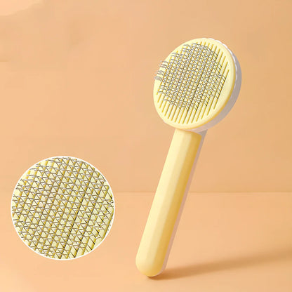 Self-cleaning cat comb with floating needle teeth and built-in hair storage chamber in assorted colours