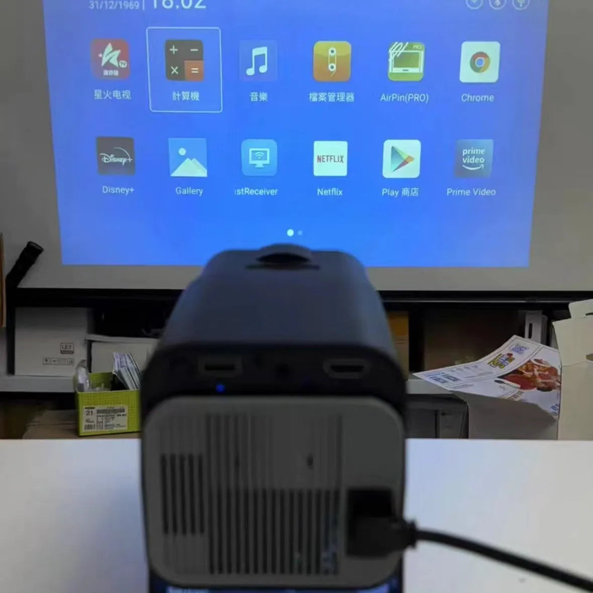 Handheld wireless HD game projector showing 720p resolution for home use.
