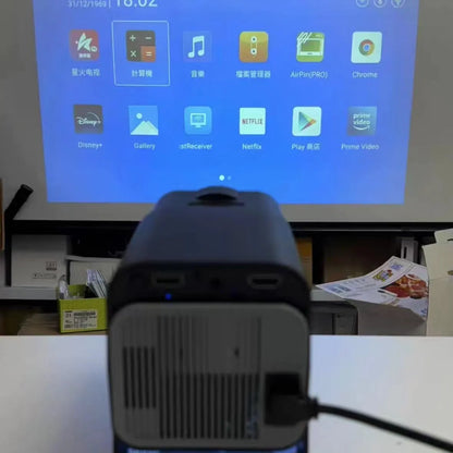 Handheld wireless HD game projector showing 720p resolution for home use.