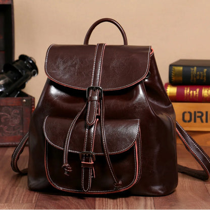 Korean style cowhide leather backpack in black with front sandwich pockets and internal organisation compartments