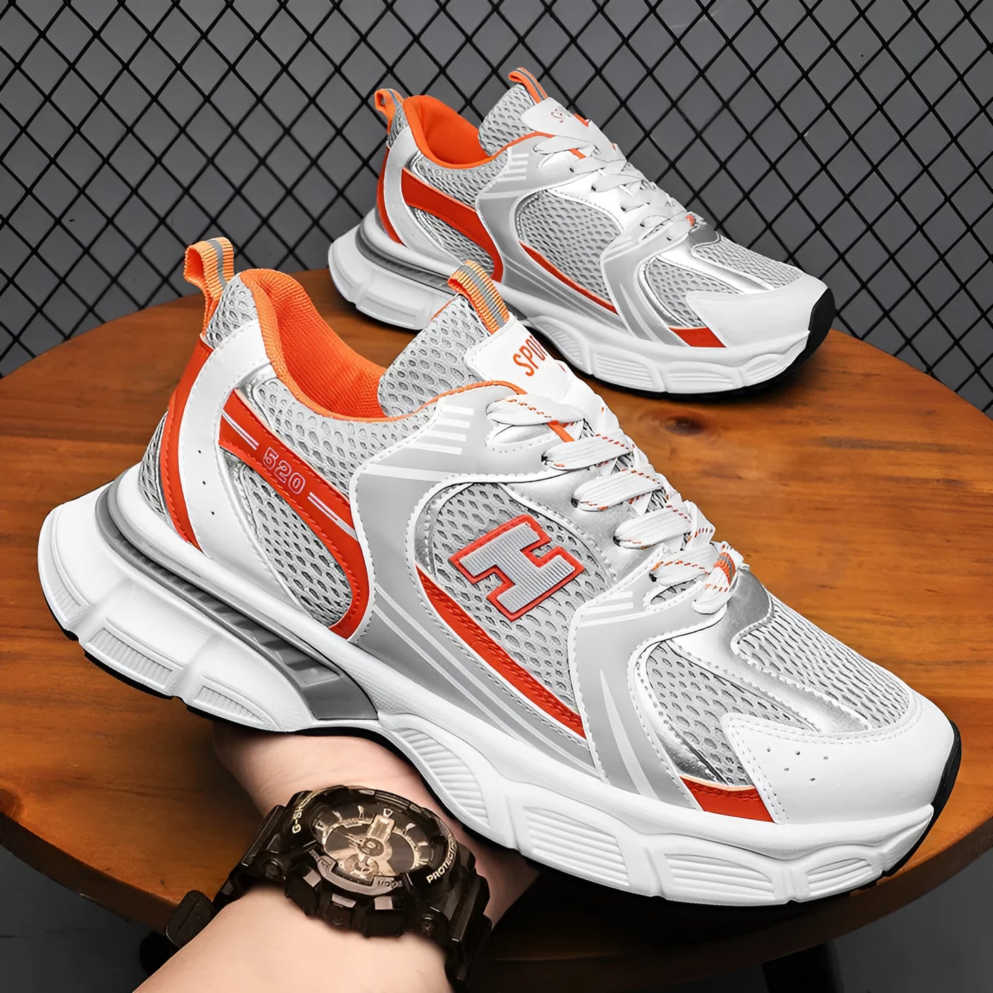 Men's mesh running shoes with plastic sole in black, white and grey, or white and orange colours