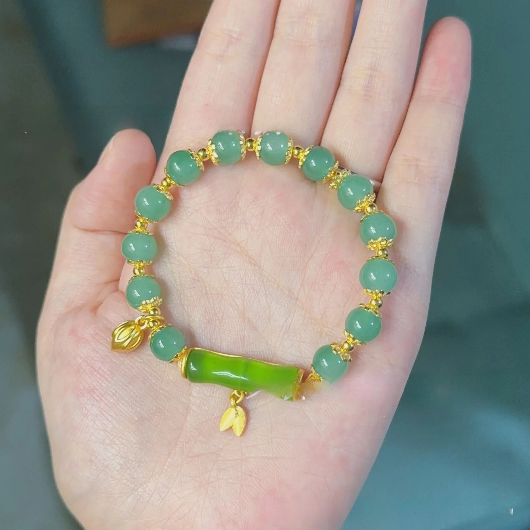 Retro bamboo design bracelet with floral shape and ruyi element in glass and coloured glaze