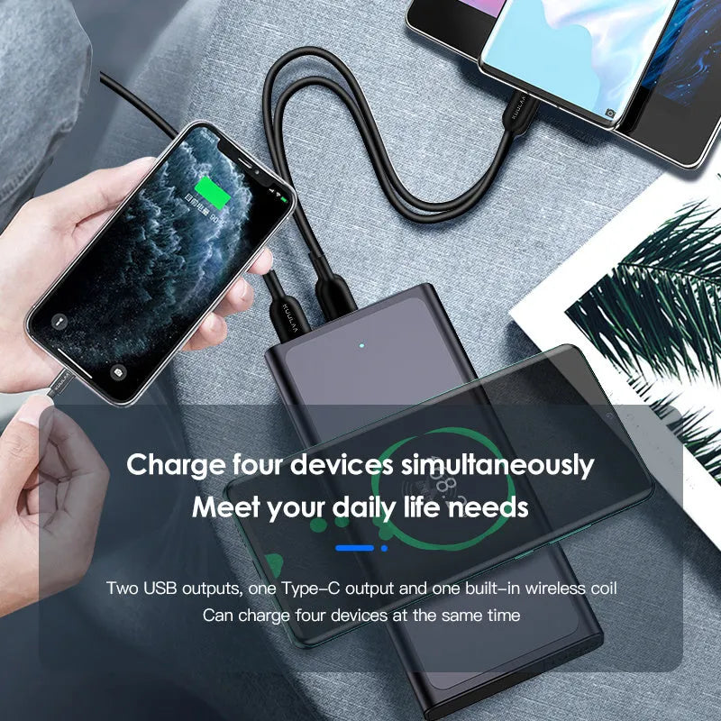Black and blue alloy 10000mAh power bank with wireless charging surface and integrated plug.