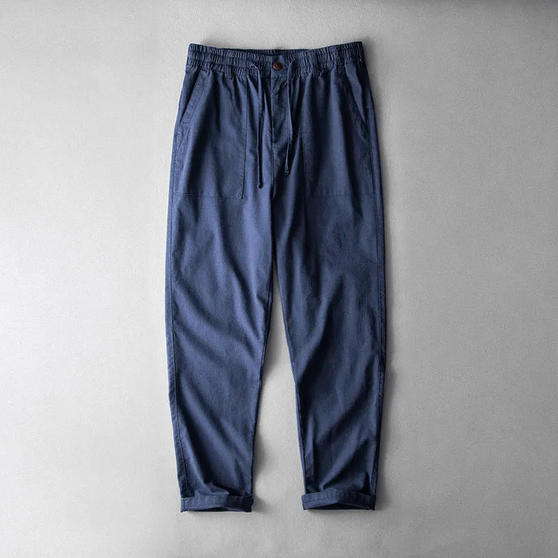 Men's solid colour linen trousers in mid-waist design available in three colours
