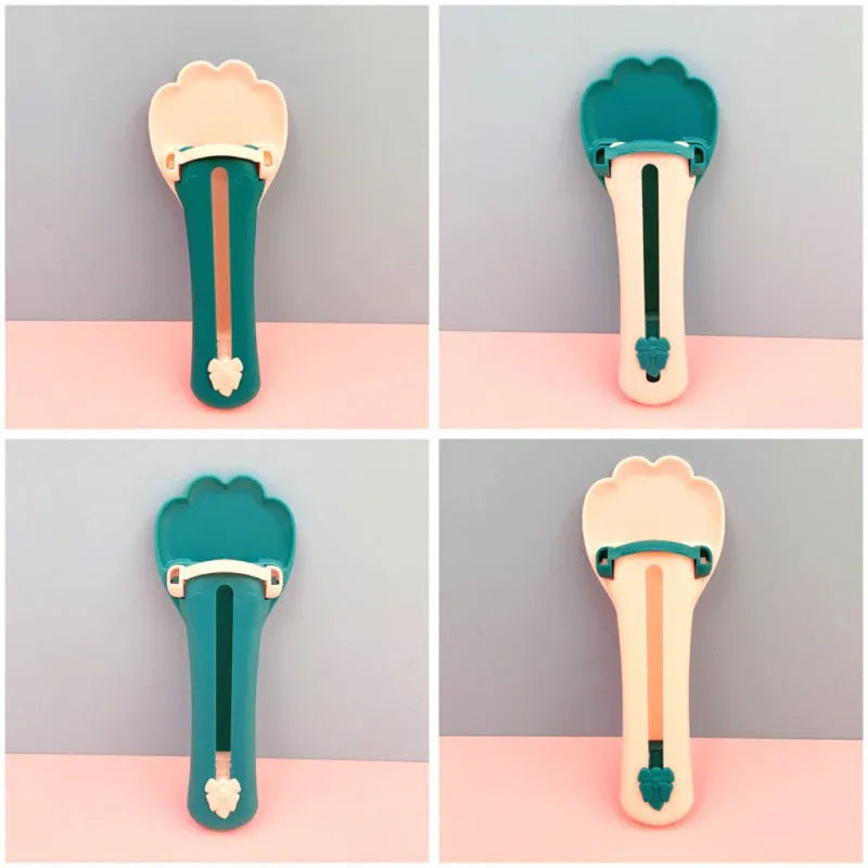Green plastic pet food scoop with squeezer handle and dispensing nozzle for kibble and liquid.