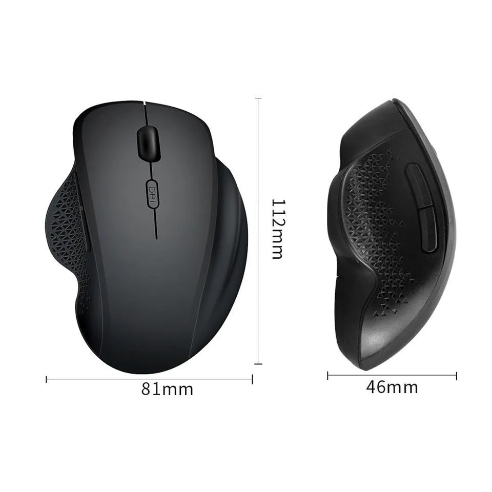 Grey and black wireless notebook mouse with USB charging cable on a laptop keyboard
