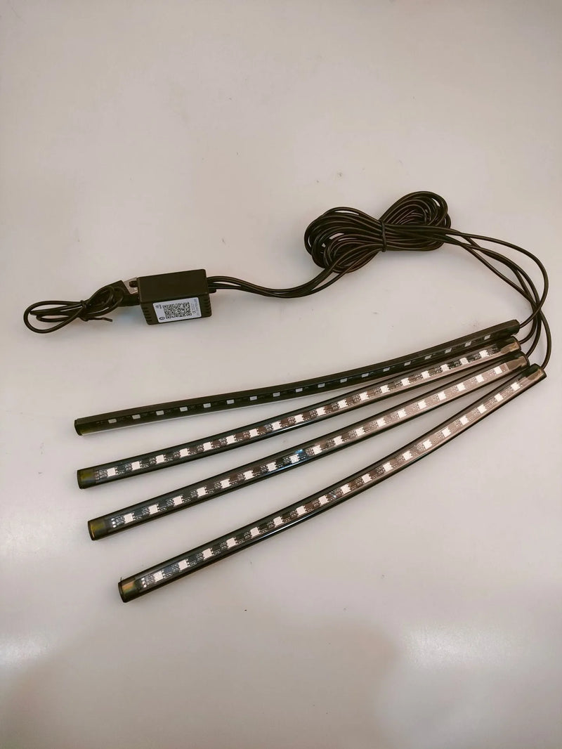 Car interior atmosphere light with eight-colour LED footwell voice control rhythm lighting system for vehicle modification and customisation, featuring PVC construction and USB-powered 12V operation with 36-light strip and universal fit for most cars