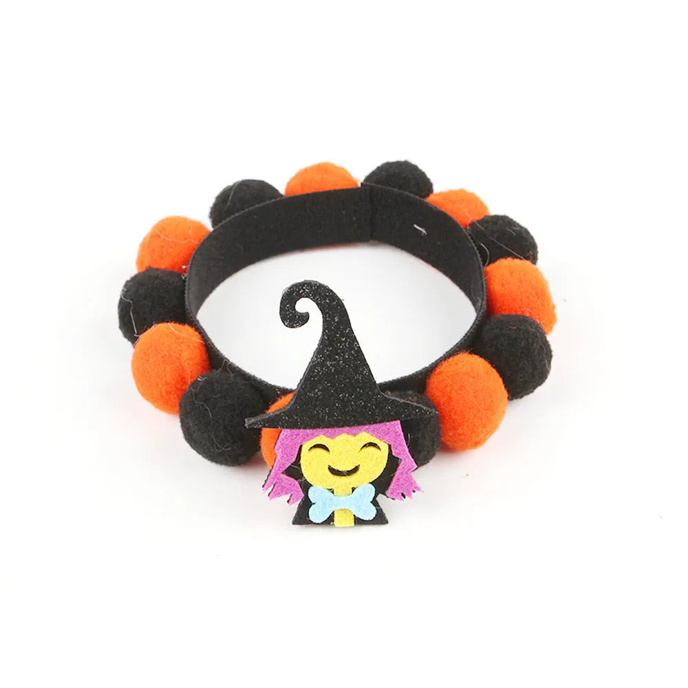 Halloween pet collar with fur ball decoration in pumpkin design