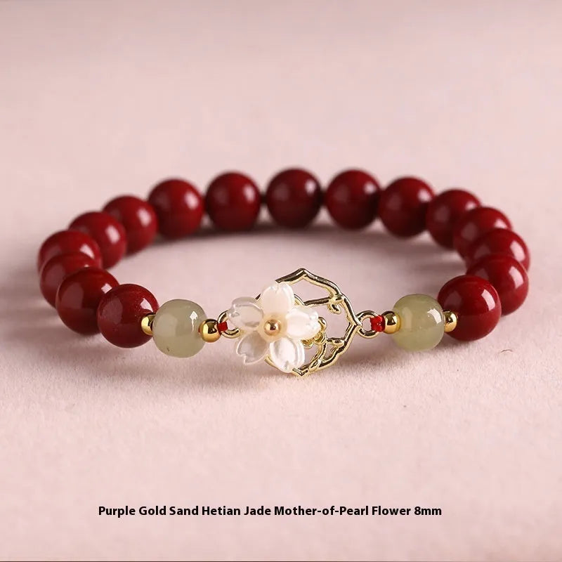 Handcrafted cinnabar bracelet with Hetian jade elements and lotus motifs in New Chinese style showing purple gold sand and emperor sandstone colour options