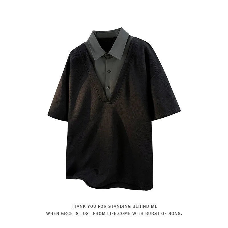 Man wearing a black henley collar short sleeve spandex pullover sweater.