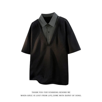 Man wearing a black henley collar short sleeve spandex pullover sweater.