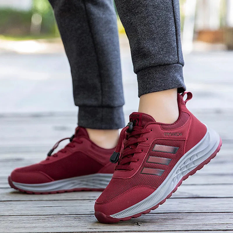 Unisex slip-on casual shoes with mesh upper and elastic band in various colours.