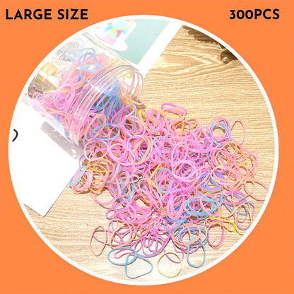 Assorted colourful thin TPU baby hair ties for toddlers and kids in a reusable plastic storage container.