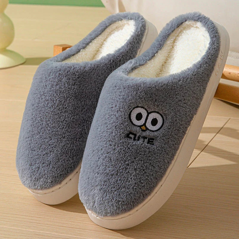 Stylish and cozy cartoon-inspired slippers with plush material and non-slip rubber soles, perfect for keeping feet warm and comfortable at home.