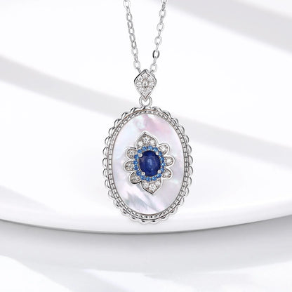 Elegant sapphire and diamond pendant necklace in 925 sterling silver, featuring a sparkling gemstone design and adjustable chain.