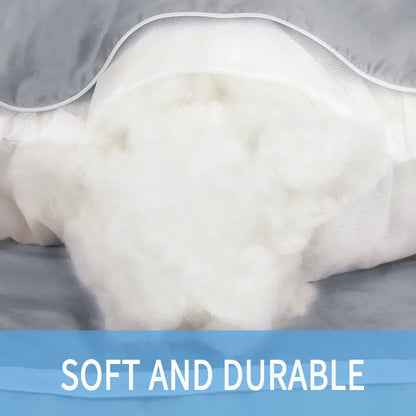 Light blue U-shaped ice silk maternity pillow for pregnancy support on a bed