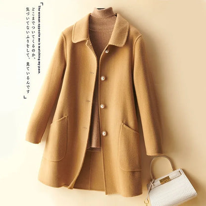 Women's double-faced wool mid-length coat with a doll collar and pearl buckle detail in a solid colour.
