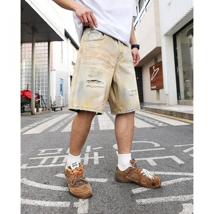 Men's light blue denim shorts with distressed finish and straight-leg silhouette