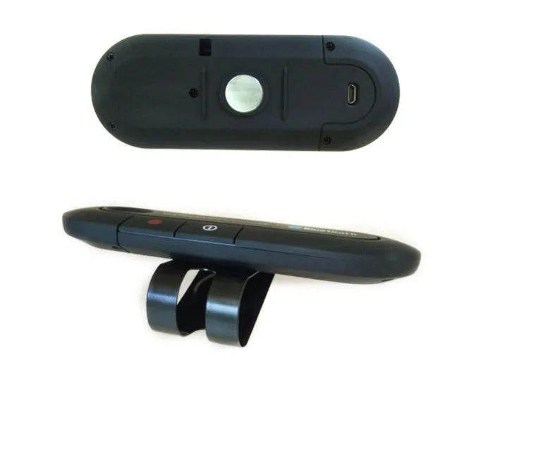 Black Bluetooth hands-free car kit mounted on a car sun visor with charger and cable.